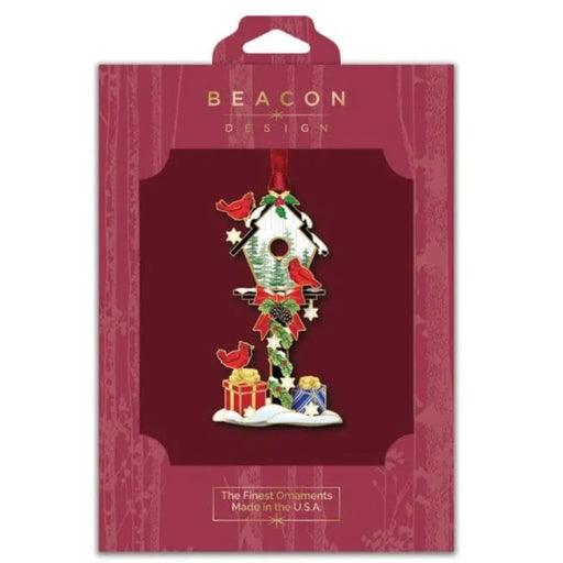 Christmas ornament packaging with 'Beacon Design' branding on a red background