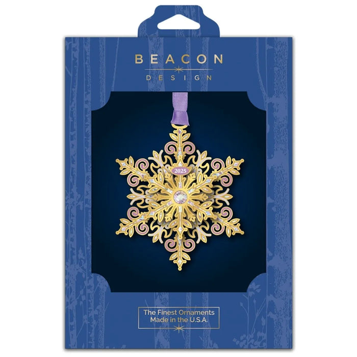 Gold snowflake ornament in Beacon Design packaging on a white background