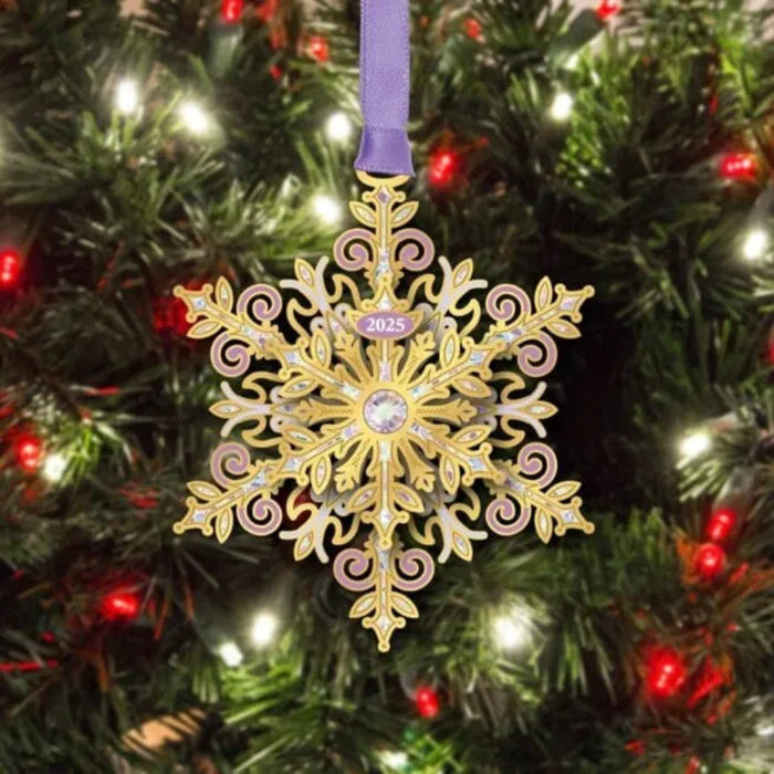 Decorative snowflake ornament with '2025' on a Christmas tree.