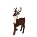 Furry reindeer figurine by Byers' Choice in a prancing pose, with detailed features and holiday styling.