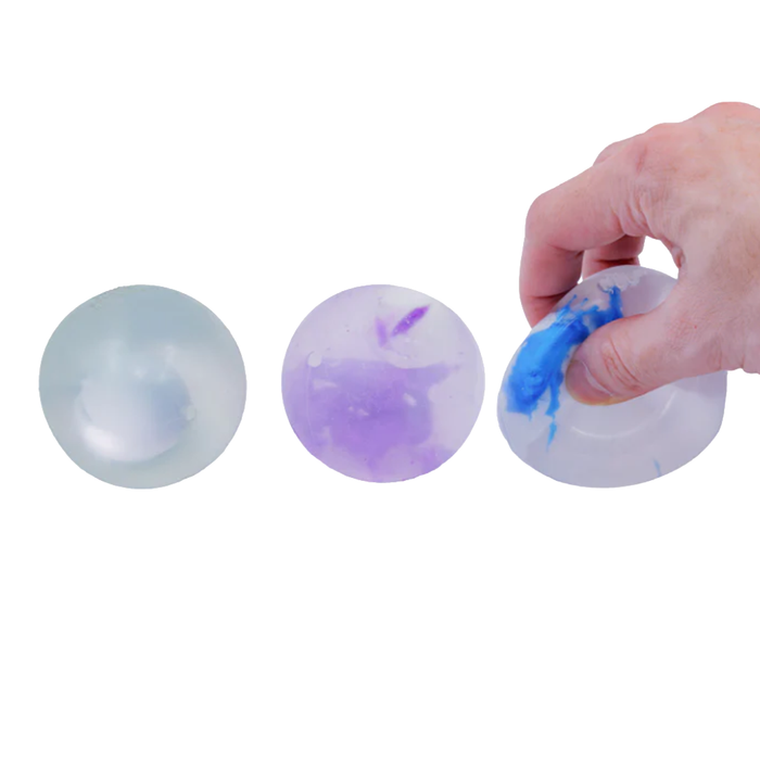 Three clear silicone ice molds on a white background with a hand interacting with one of them.