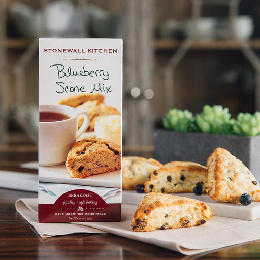 "Stonewall Kitchen Blueberry Scone Mix with baked scones and fresh blueberries on table"