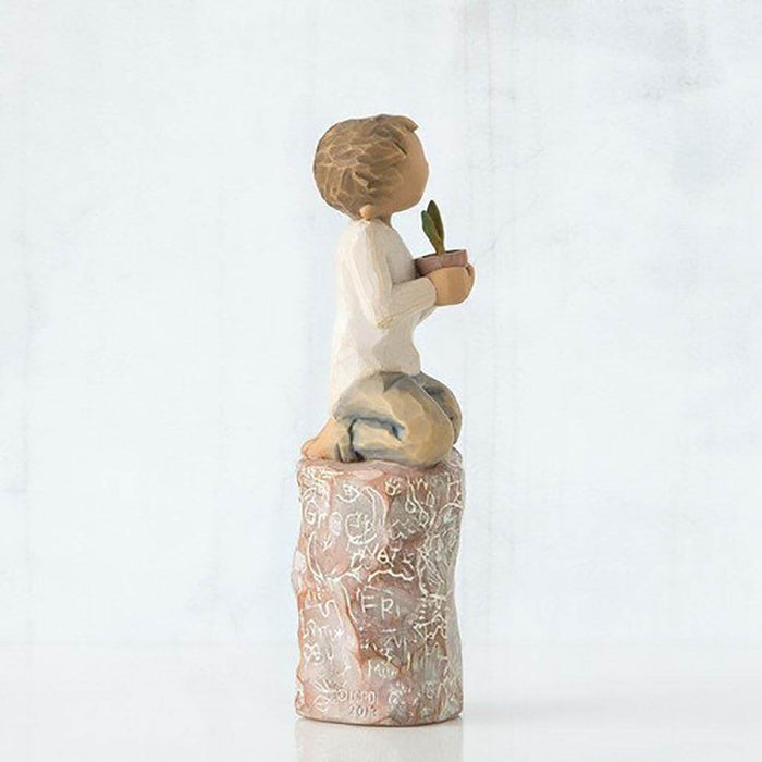 "Willow Tree Something Special Figurine – boy kneeling with potted plant on carved base, hand-painted resin sculpture by Susan Lordi symbolizing kindness and gratitude"