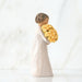 "Willow Tree Good Cheer Figurine – woman holding bouquet of yellow roses, hand-carved resin sculpture by Susan Lordi symbolizing happiness and encouragement"