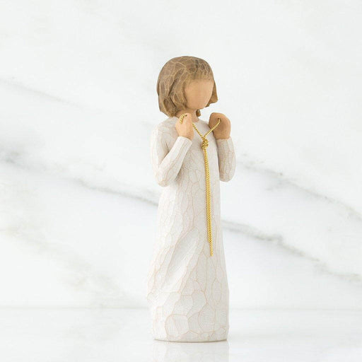 "Willow Tree Truly Golden figurine of a girl in white dress holding a gold necklace, symbolizing friendship and appreciation."