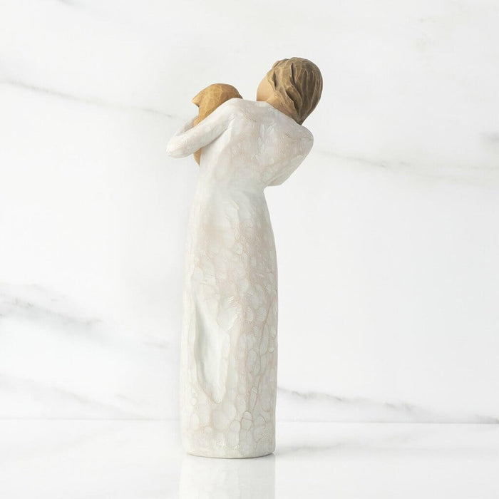 "Willow Tree Adorable You Figurine – Woman holding golden-colored dog, hand-painted resin sculpture celebrating pet love and friendship"