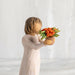 "Willow Tree Little Things figurine of a girl holding a potted flower, symbolizing gratitude and appreciation"