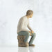 "Willow Tree My Guy figurine of a seated man in a relaxed pose, symbolizing quiet strength and companionship"
