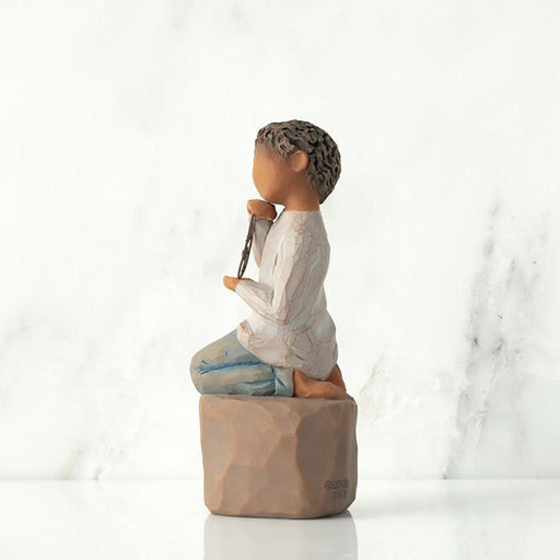"Willow Tree Love You Too figurine – boy with darker skin kneeling on a pedestal, holding a wire circle that says 'love you' in script."