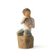 "Willow Tree Love You Too figurine – hand-painted sculpture of a boy with lighter skin kneeling and holding a wire sign that says 'love you'."