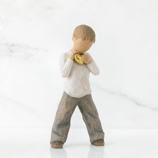 "Willow Tree Heart of Gold figurine – hand-painted resin sculpture of young boy holding a golden heart close to his chest, symbolizing love and kindness."