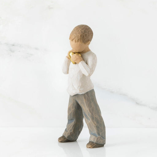 "Willow Tree Heart of Gold figurine – hand-painted resin sculpture of young boy holding a golden heart close to his chest, symbolizing love and kindness."