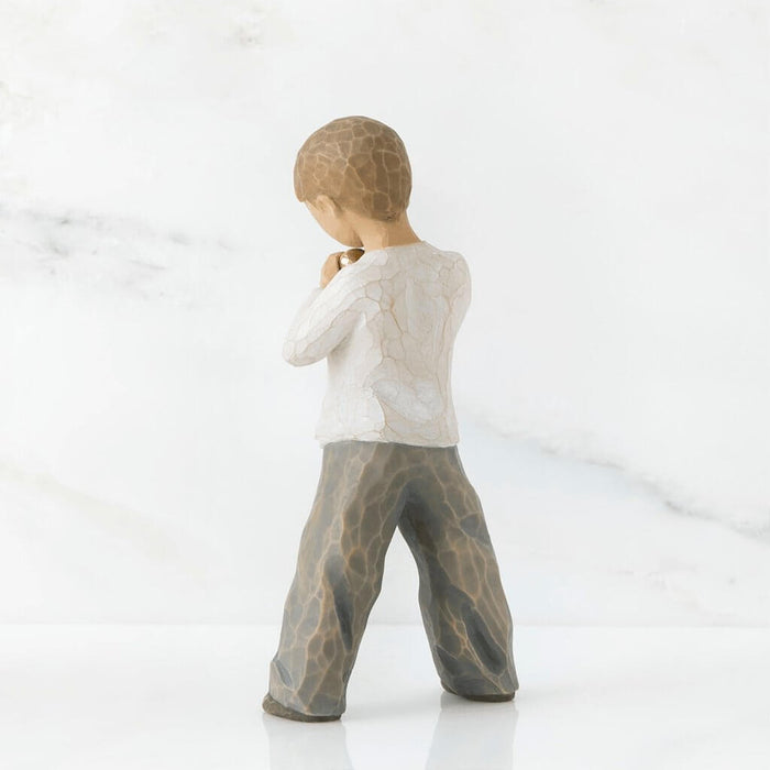 "Willow Tree Heart of Gold figurine – hand-painted resin sculpture of young boy holding a golden heart close to his chest, symbolizing love and kindness."