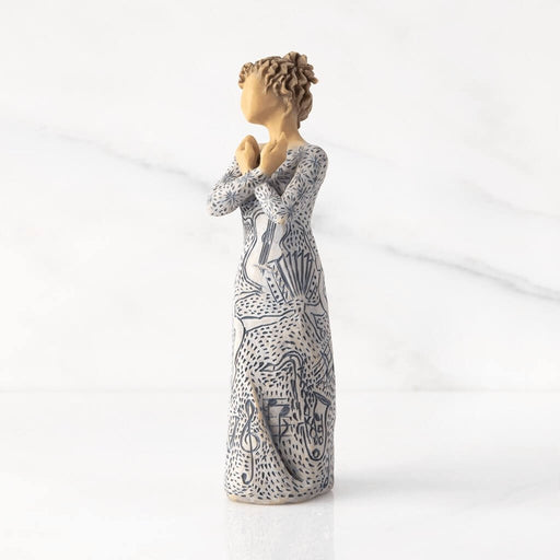 "Willow Tree Music Speaks figurine with lighter skin tone – hand-painted resin sculpture featuring musical instrument carvings and heart-holding pose"