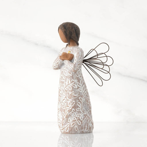 "Willow Tree Remembrance angel figurine with darker skin tone – hand-painted resin figure with floral design, wire wings, and gold heart for memory and healing."
