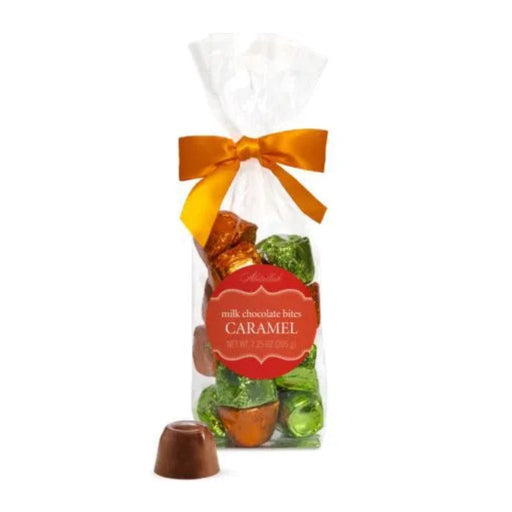 "Bag of milk chocolate bites with caramel flavor, tied with an orange ribbon on a white background."