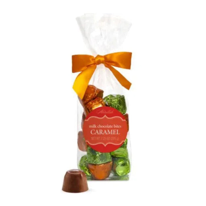"Bag of milk chocolate bites with caramel flavor, tied with an orange ribbon on a white background."
