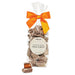 "Bag of chocolate almond milk toffee with an orange bow on a white background"