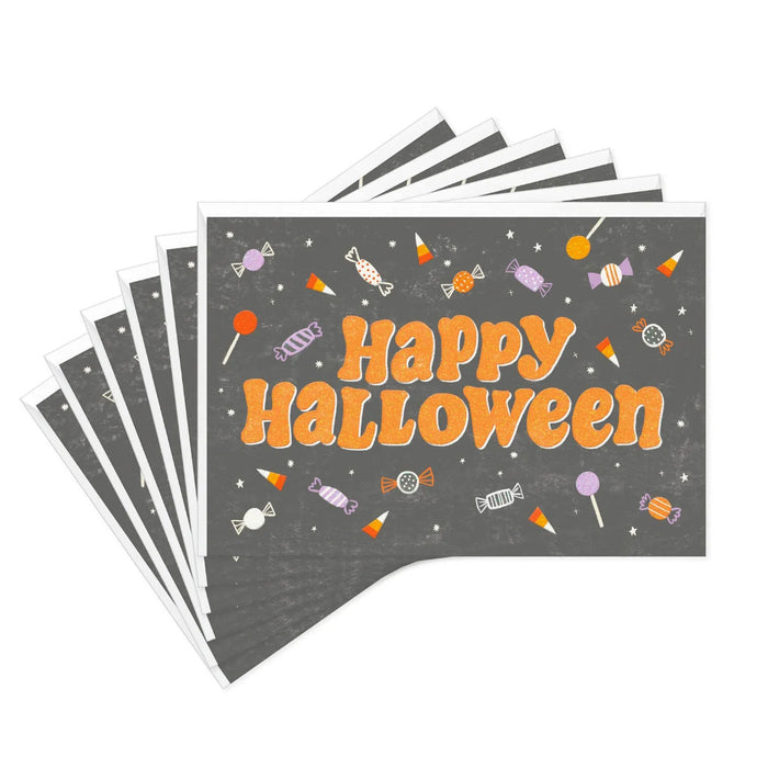 Close-up of Hallmark Halloween card with colorful candy artwork and sparkling glitter details