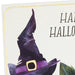 Hallmark Halloween greeting card featuring a black cat in a witch's hat surrounded by glowing jack-o'-lanterns.