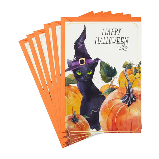 Hallmark Halloween greeting card featuring a black cat in a witch's hat surrounded by glowing jack-o'-lanterns.