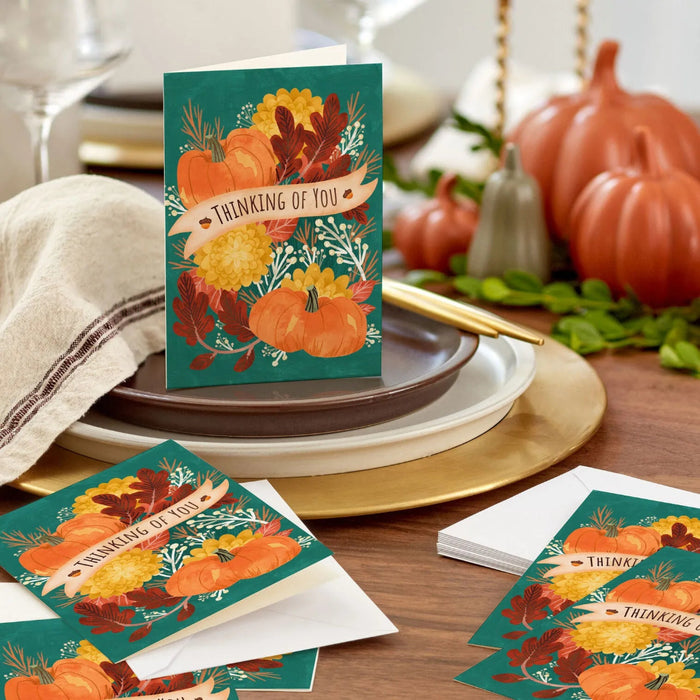 Boxed Hallmark Thanksgiving cards with harvest artwork, pumpkins, golden acorns, deep red leaves, and matching envelopes.