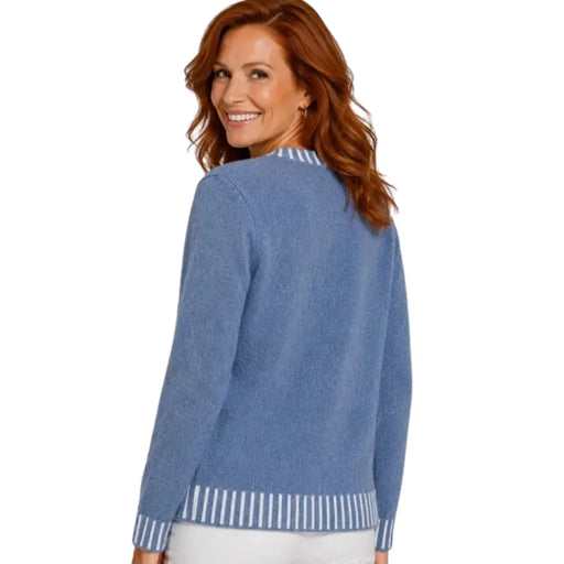 A woman with red hair is shown from the back wearing a heathered blue knit cardigan with white striped ribbed trim at the collar, cuffs, and hem, against a plain white background.