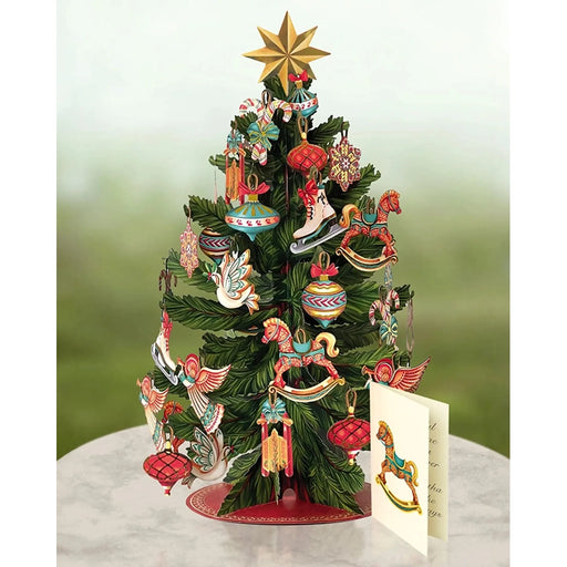 Decorative pop up  Christmas tree with colorful ornaments on a card
