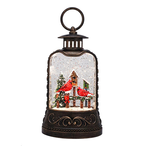 Decorative lantern snow globe with Christmas scene featuring a cardinals.
