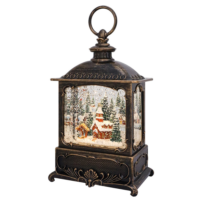 Decorative lantern with a Christmas village scene inside on a white background