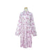Pink robe with pattern on a mannequin against a white background