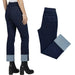 Dark blue denim jeans with a light blue cuffed hem, shown on a model from the back and as a flat product view on a white background.