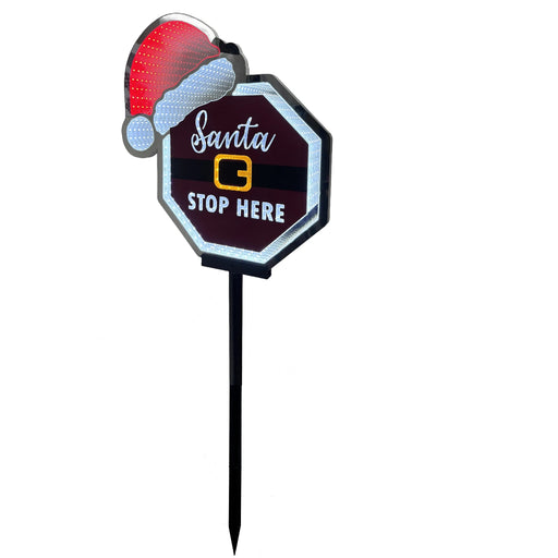 Decorative sign with Santa hat and 'Santa Stop Here' text on a white background