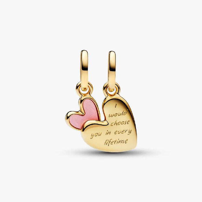 A charming heart-shaped pendant adorned with smooth pink enamel, radiating a cheerful aesthetic.