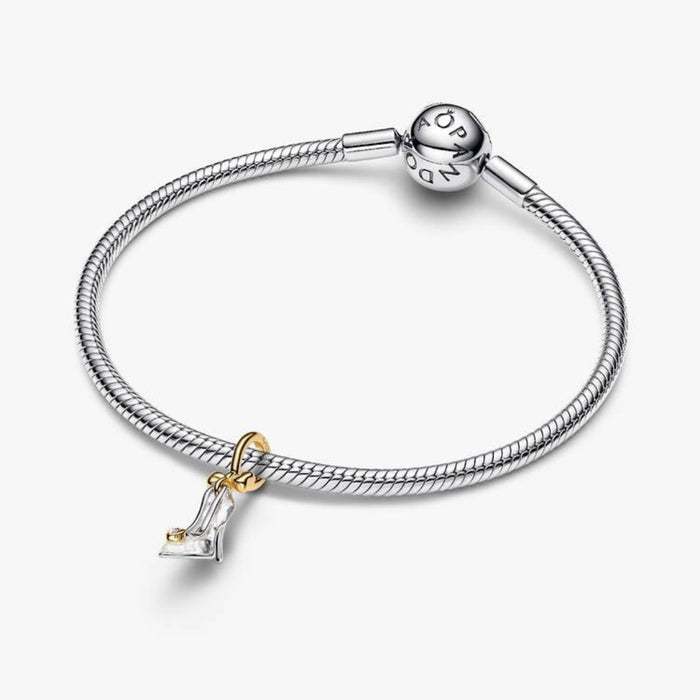 Sterling silver and 14k gold‑plated Cinderella slipper charm with bow detail on a bracelet 