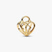 Gold heart-shaped key pendant on a white background
