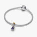 Silver bracelet with a purple heart charm on a white background