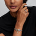 A Pandora charm showcasing a vibrant apple, symbolizing curiosity and the pursuit of knowledge.