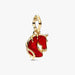 Gold pendant with a red enameled horse design on a white background