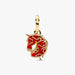 Gold pendant with red design on a white background