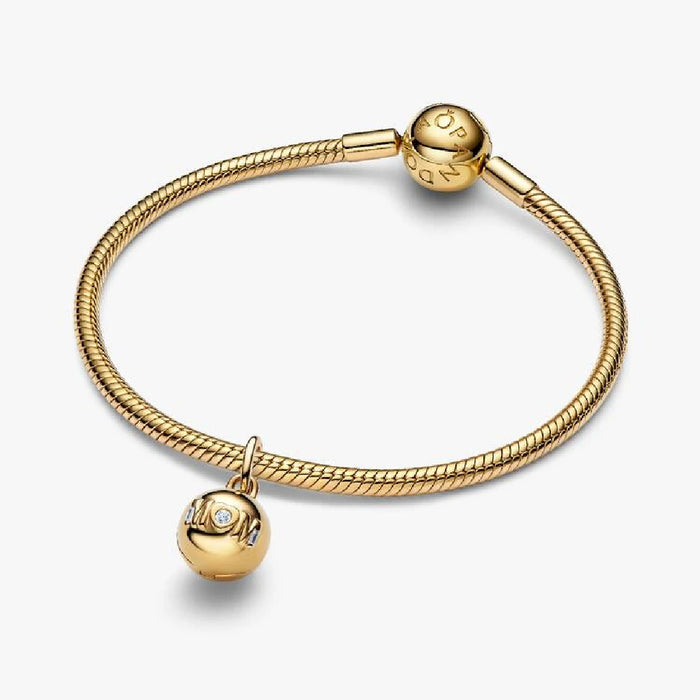 Gold "Mom" charm featuring diamond accents, symbolizing love and appreciation for mothers.
