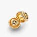 Shiny gold charm inscribed with "Mom," decorated with diamonds, perfect for celebrating motherhood.