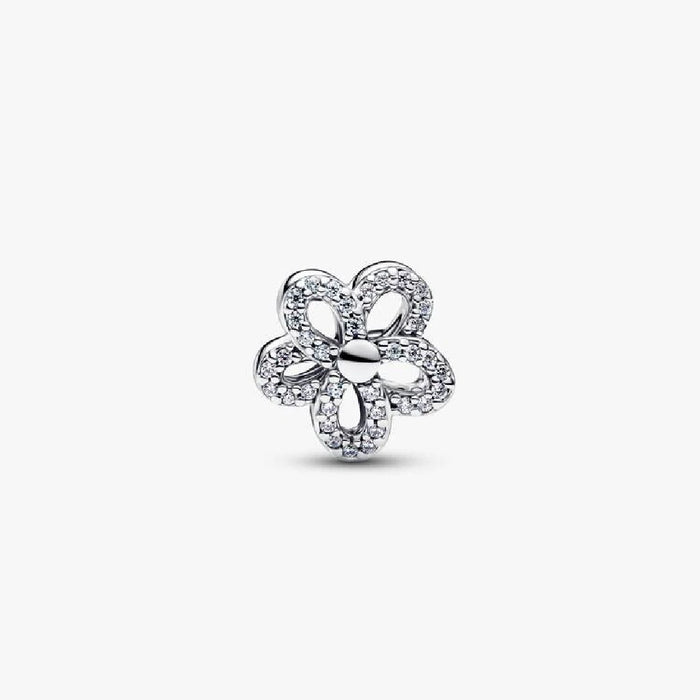A sparkling diamond flower charm set on a white background, highlighting its elegant shape and brilliance.