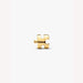 Gold puzzle piece charm on a light background