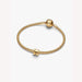 Gold bracelet on a light background