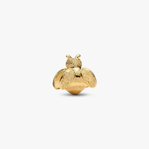 Gold bee-shaped jewelry charm on a white background