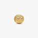 Gold smiley face charm on a white background