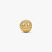 Gold smiley face charm on a white background
