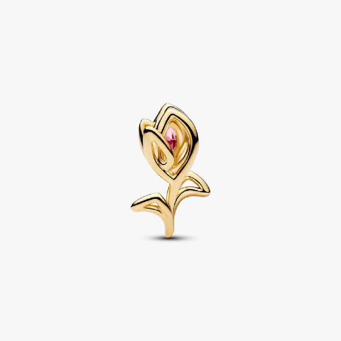 A gold plated rose charm featuring pink stones, symbolizing love and beauty in a stylish accessory.