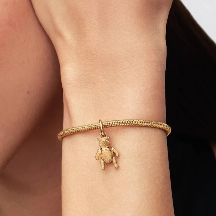 Disney Winnie the Pooh dangle charm featuring the beloved Pooh Bear character, perfect for Disney-inspired jewelry collections.
